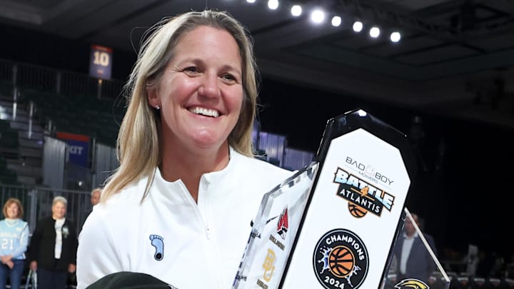 Nov 25, 2024; Paradise Island, Bahamas, BHS; North Carolina Tar Heels head coach Courtney Banghart celebrates with the Battle4Atlantis trophy after the game against the Indiana Hoosiers at the Atlantis Resort. Mandatory Credit: Kevin Jairaj-Imagn Images
