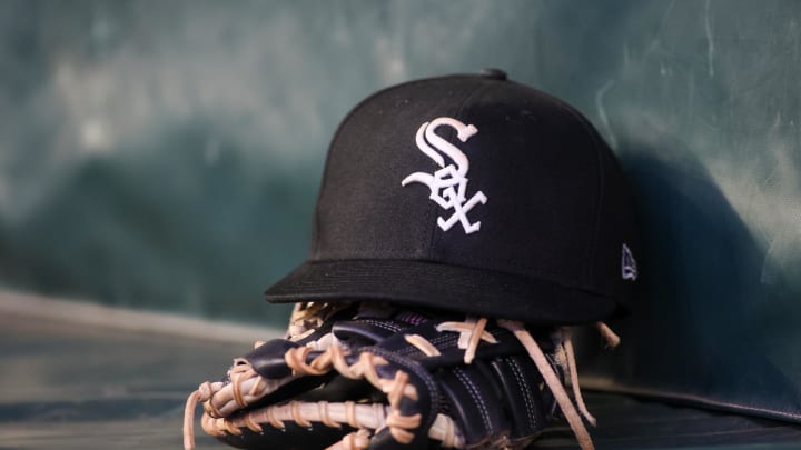 Jul 14, 2023; Atlanta, Georgia, USA; A detailed view of a Chicago White Sox hat and glove in the dugout against the Atlanta Braves in the fourth inning at Truist Park. Mandatory Credit: Brett Davis-USA TODAY Sports