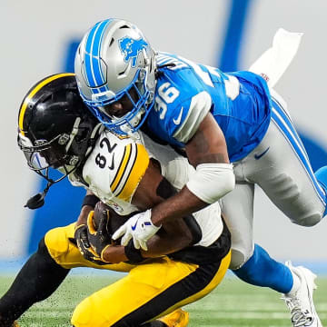 Detroit Lions cornerback Javelin Guidry (36) tackles Pittsburgh Steelers wide receiver Dez Fitzpatrick (82) during the second half of a preseason game at Ford Field in Detroit on Saturday, August 24, 2024.