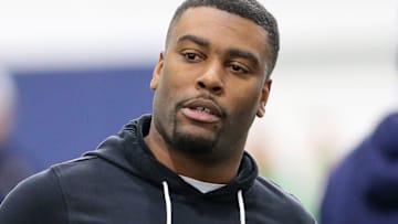 Notre Dame cornerbacks coach Mike Mickens speaks to former Irish cornerback TaRiq Bracy