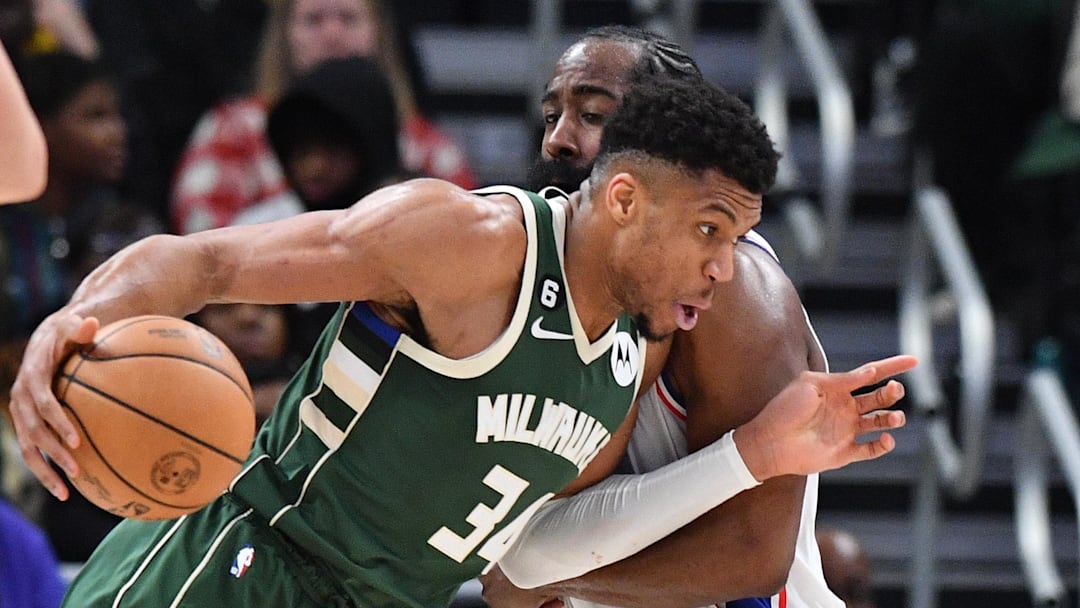 Mar 4, 2023; Milwaukee, Wisconsin, USA; Milwaukee Bucks forward Giannis Antetokounmpo (34) drives to the basket against Philadelphia 76ers guard James Harden (1) in the second half at Fiserv Forum. Mandatory Credit: Michael McLoone-Imagn Images