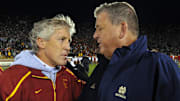 Oct. 17, 2009; South Bend, IN, USA; Southern California Trojans head coach Pete Carroll and Notre Dame Fighting Irish head coach Charlie Weis shake hands after Southern California defeated Notre Dame 34-27 at Notre Dame Stadium. Mandatory Credit: Matt Cashore-Imagn Images