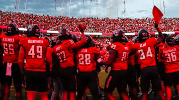 Sep 27, 2025; Raleigh, North Carolina, USA; North Carolina State Wolfpack bench celebrates before the first half of the game against Virginia Tech Hokies at Carter-Finley Stadium. Mandatory Credit: Jaylynn Nash-Imagn Images