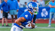 Detroit Catholic Central's Samson Gash returns a punt during a football game on Friday, Aug. 29, 2025.