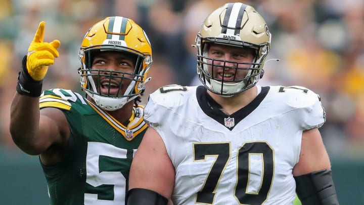 Green Bay Packers linebacker Kingsley Enagbare (55) points out a holding penalty committed by New Orleans Saints offensive tackle Trevor Penning (70)