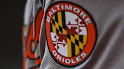 May 5, 2024; Cincinnati, Ohio, USA; The Baltimore Orioles logo on the sleeve of designated hitter Gunnar Henderson (2) as he prepares on deck during the seventh inning against the Cincinnati Reds at Great American Ball Park. 