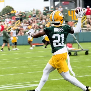 Nate Hobbs intercepts a pass during drills at Packers training camp.