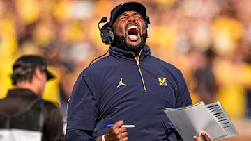 Michigan head coach Sherrone Moore cheers on before a play against Washington during the first half at Michigan Stadium in Ann Arbor on Saturday, Oct. 18, 2025.