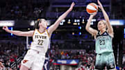 May 24, 2025; Indianapolis, Indiana, USA; New York Liberty guard Marine Johannès (23) goes up for a 3-pointer against Indiana Fever guard Caitlin Clark (22) during a game between the Indiana Fever and the New York Libertyat Gainbridge Fieldhouse. Mandatory Credit: Grace Smith/USA Today Network via Imagn Images