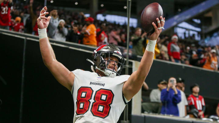Dec 10, 2023; Atlanta, Georgia, USA; Tampa Bay Buccaneers tight end Cade Otton (88) celebrates after a touchdown catch against the Atlanta Falcons in the second half at Mercedes-Benz Stadium. Mandatory Credit: Brett Davis-USA TODAY Sports