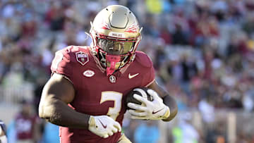 Nov 23, 2024; Tallahassee, Florida, USA; Florida State Seminoles running back Kam Davis (3) runs the ball during the second half of the game against the Charleston Southern Buccaneers at Doak S. Campbell Stadium. Mandatory Credit: Melina Myers-Imagn Images