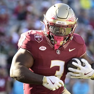 Nov 23, 2024; Tallahassee, Florida, USA; Florida State Seminoles running back Kam Davis (3) runs the ball during the second half of the game against the Charleston Southern Buccaneers at Doak S. Campbell Stadium. Mandatory Credit: Melina Myers-Imagn Images