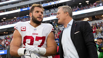 San Francisco 49ers defensive end Nick Bosa (L) and general manager John Lynch (R)