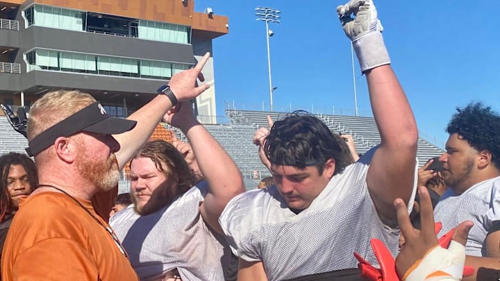 Hutto football coach Will Compton, leading his team during a post-practice break, in 2023. Compton will not return as the head coach in 2025, taking over as the district athletic director.