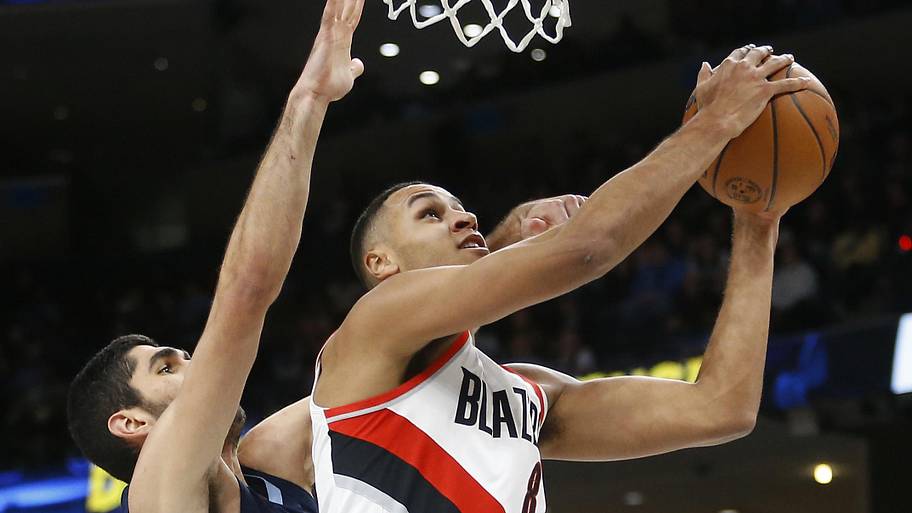 Portland Trail Blazers forward Kris Murray shoots as Memphis Grizzlies forward-center Santi Aldama defends.