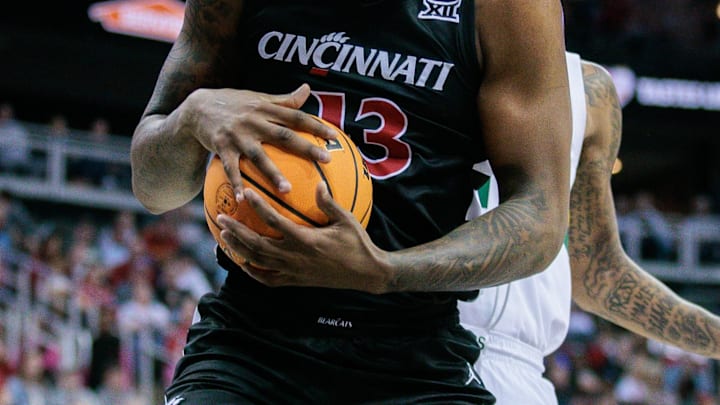 Mar 14, 2024; Kansas City, MO, USA; Cincinnati Bearcats forward Jamille Reynolds (13) rebounds the ball during the first half against the Baylor Bears at T-Mobile Center. Mandatory Credit: William Purnell-Imagn Images