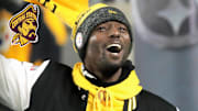 Jan 4, 2025; Pittsburgh, Pennsylvania, USA; Pittsburgh Steelers former wide receiver and Super Bowl XLIII MVP Santonio Holmes leads the Terrible Towel wave before the game against the Cincinnati Bengals at Acrisure Stadium. 