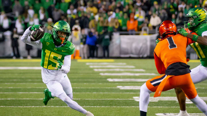 Oregon wide receiver Tez Johnson caries the ball for the Ducks as the No. 6 Oregon Ducks take on the No. 16 Oregon State Beavers Friday, Nov. 24, 2023, at Autzen Stadium in Eugene, Ore.