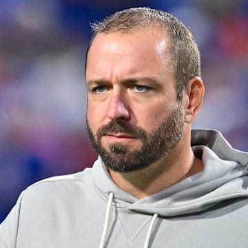 Miami Dolphins offensive coordinator Frank Smith on the field before a game against the Buffalo Bills at Highmark Stadium. 