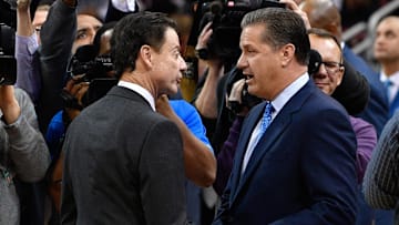  Louisville Cardinals head coach Rick Pitino shakes hands with Kentucky Wildcats head coach John Calipari before the first half at KFC Yum! Center. Louisville defeated Kentucky 73-70.  