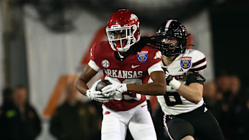 Dec 27, 2024; Memphis, TN, USA; Arkansas Razorbacks wide receiver Dazmin James (83) runs after a catch during the second quarter against the Texas Tech Red Raiders at Simmons Bank Liberty Stadium. Mandatory Credit: Petre Thomas-Imagn Images