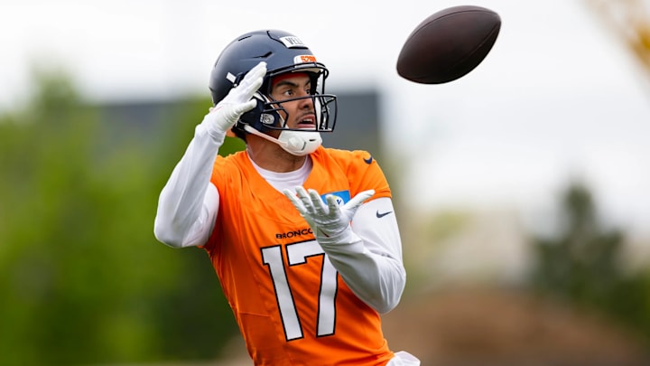 Denver Broncos wide receiver Devaughn Vele (17) catches a pass during voluntary minicamp practice at Broncos Park Powered by CommonSpirit. Denver Broncos wide receiver Devaughn Vele (17) catches a pass during voluntary minicamp practice at Broncos Park Powered by CommonSpirit.