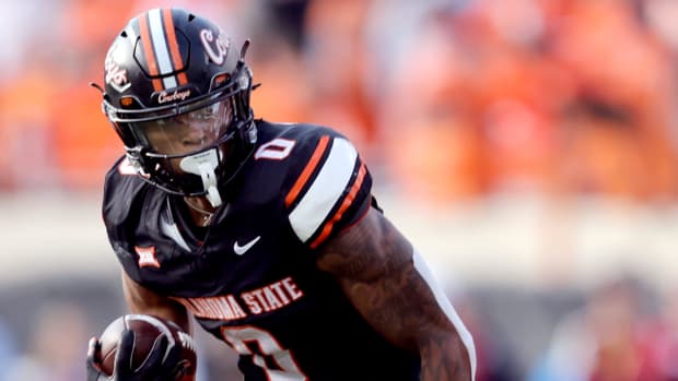 Oklahoma State's Ollie Gordon II (0) rushes. SARAH PHIPPS/THE OKLAHOMAN / USA TODAY NETWORK