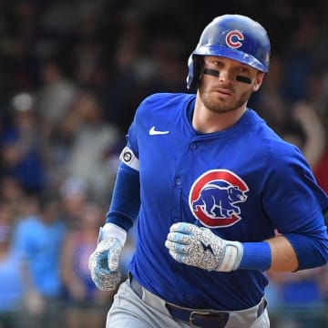 Jun 29, 2024; Milwaukee, Wisconsin, USA; Chicago Cubs outfielder Ian Happ (8) rounds the bases after hitting a home run against the Milwaukee Brewers in the eighth inning at American Family Field.