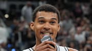 Victor Wembanyama talks to the San Antonio Spurs fans after the game against the Brooklyn Nets.