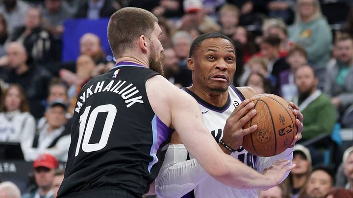 Nov 28, 2025; Salt Lake City, Utah, USA; Sacramento Kings guard Russell Westbrook (18) tries to get past Utah Jazz guard Svi Mykhailiuk (10) and to the basket during the first quarter at Delta Center. Mandatory Credit: Chris Nicoll-Imagn Images