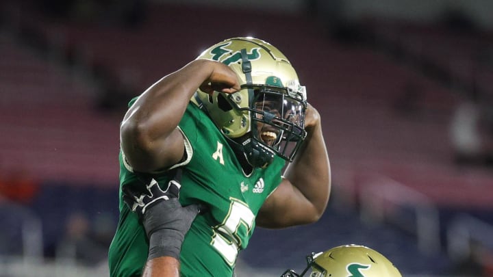 Dec 21, 2023; Boca Raton, FL, USA;  South Florida Bulls running back Nay'Quan Wright (5) celebrates with offensive lineman Donovan Jennings (73) after scoring a touchdown against the Syracuse Orange in the fourth quarter during the RoofClaim.com Boca Raton Bowl at FAU Stadium. Mandatory Credit: Nathan Ray Seebeck-USA TODAY Sports