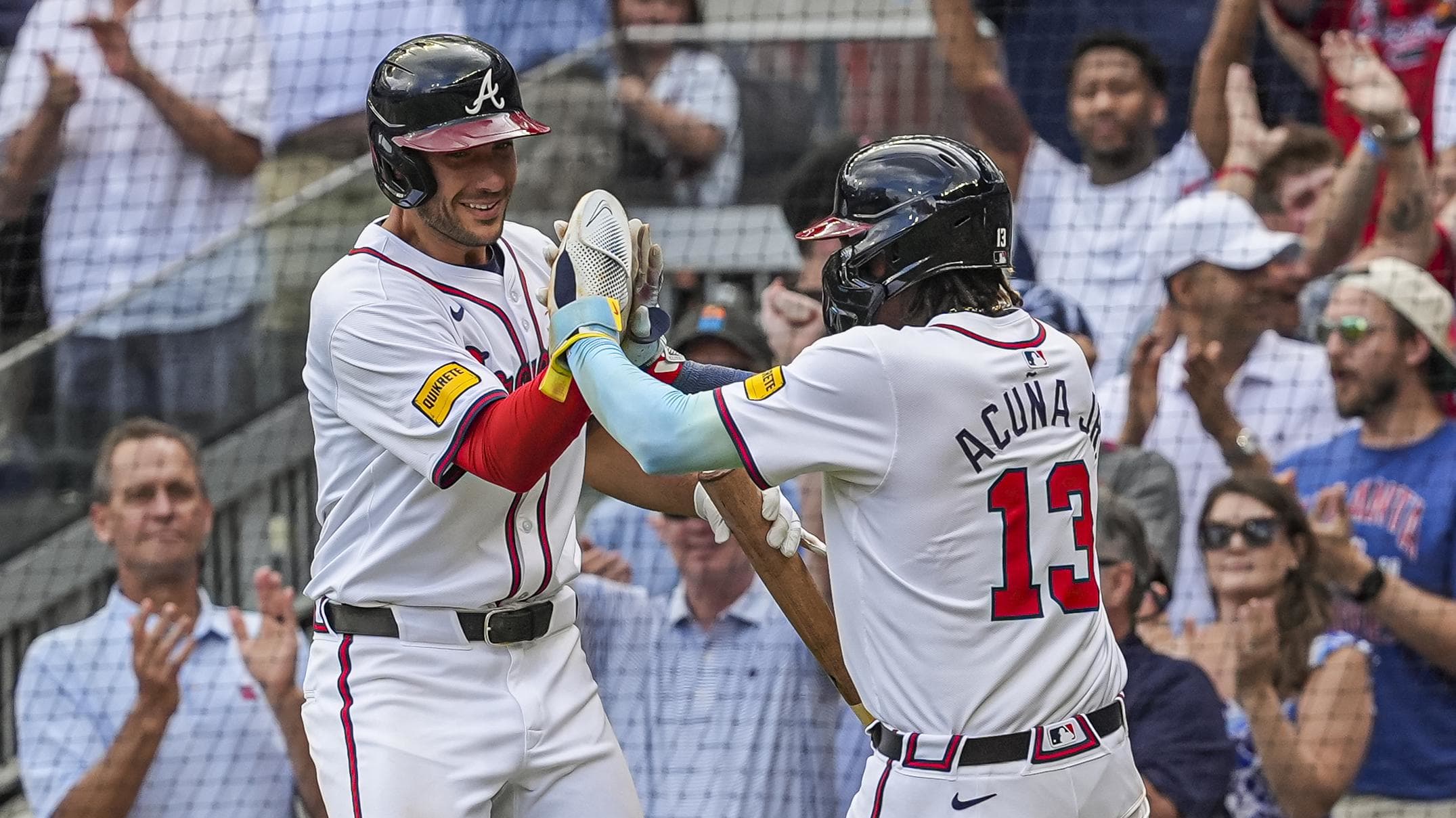 Atlanta Braves right fielder Ronald Acuna Jr and first baseman Matt Olson celebrate scoring the winning run in the 10th inning of Sunday's victory over the Cleveland Guardians