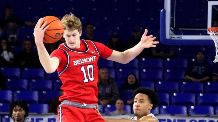 Belmont guard Cade Tyson (10) grabs the ball as Middle Tennessee guard Jacob Johnson (15) guards him during the men   s basketball game on Saturday, Dec. 9, 2023, at MTSU..