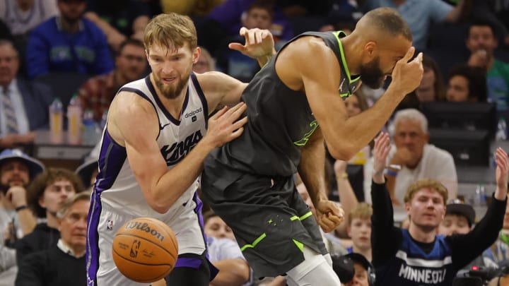 Mar 1, 2024; Minneapolis, Minnesota, USA; Sacramento Kings center Domantas Sabonis (10) goes to the ball after fouling Minnesota Timberwolves center Rudy Gobert (27) in overtime at Target Center. Mandatory Credit: Bruce Kluckhohn-USA TODAY Sports