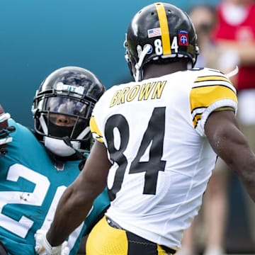 Nov 18, 2018; Jacksonville, FL, USA; Jacksonville Jaguars defensive back Jalen Ramsey (20) makes an interception in front of Pittsburgh Steelers wide receiver Antonio Brown (84) during the third quarter at TIAA Bank Field. Mandatory Credit: Douglas DeFelice-Imagn Images
