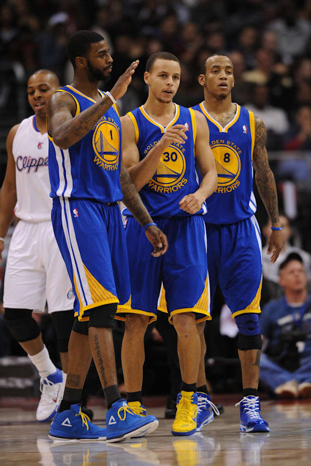 Golden State Warriors guard Stephen Curry (30), guard Monta Ellis (8), and forward Dorell Wright (1) 