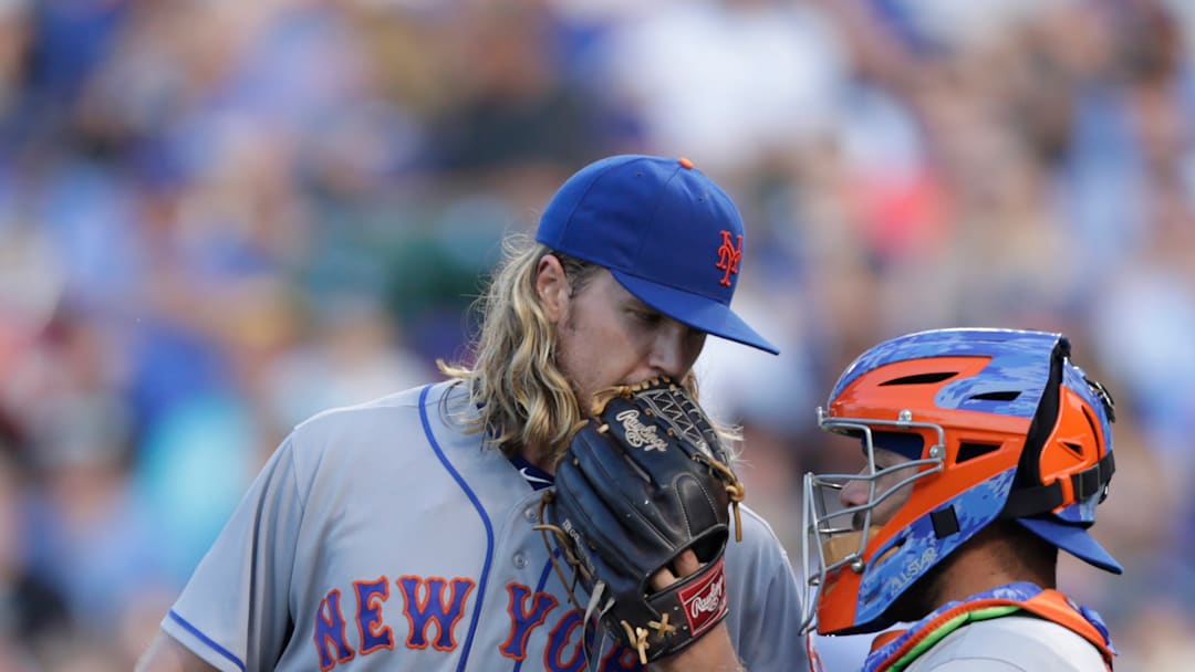 Mets Pitcher Noah Syndergaard talks to Catcher Rene Rivera during a regular season game.