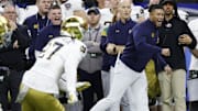 Jan 2, 2025; New Orleans, LA, USA; Notre Dame Fighting Irish head coach Marcus Freeman (R) reacts on the sidelines in the final minute against the Georgia Bulldogs during the fourth quarter at Caesars Superdome. Mandatory Credit: Geoff Burke-Imagn Images