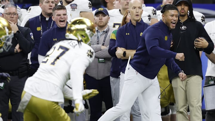 Jan 2, 2025; New Orleans, LA, USA; Notre Dame Fighting Irish head coach Marcus Freeman (R) reacts on the sidelines in the final minute against the Georgia Bulldogs during the fourth quarter at Caesars Superdome. Mandatory Credit: Geoff Burke-Imagn Images Jan 2, 2025; New Orleans, LA, USA; Notre Dame Fighting Irish head coach Marcus Freeman (R) reacts on the sidelines in the final minute against the Georgia Bulldogs during the fourth quarter at Caesars Superdome. Mandatory Credit: Geoff Burke-Imagn Images