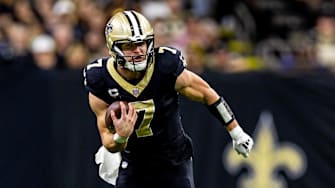 Nov 17, 2024; New Orleans, Louisiana, USA;  New Orleans Saints tight end Taysom Hill (7) runs after a catch against the Cleveland Browns during the first half at Caesars Superdome. Mandatory Credit: Stephen Lew-Imagn Images