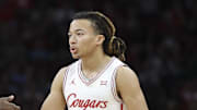Dec 6, 2025; Houston, TX, USA; Houston Cougars guard Kingston Flemings (4) celebrates with forward Joseph Tugler (11) after a play during the second half against the Florida State Seminoles at Toyota Center. Mandatory Credit: Troy Taormina-Imagn Images