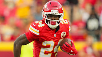 Sep 28, 2025; Kansas City, Missouri, USA; Kansas City Chiefs running back Brashard Smith (24) runs the ball during the second half against the Baltimore Ravens at GEHA Field at Arrowhead Stadium.