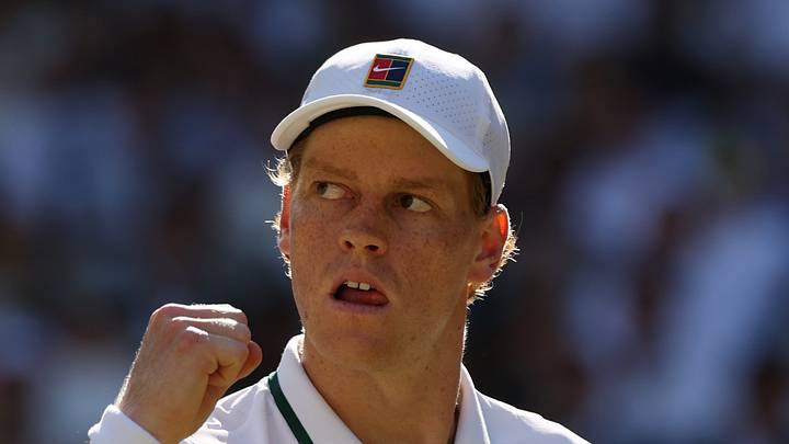 Jannik Sinner reacts after winning a point