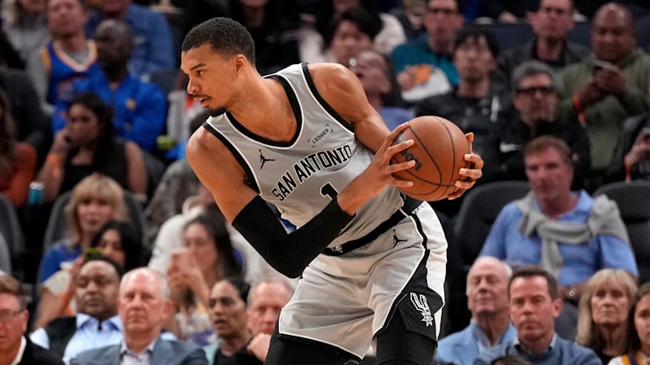 San Antonio Spurs center Victor Wembanyama holds onto the ball against the Golden State Warriors.