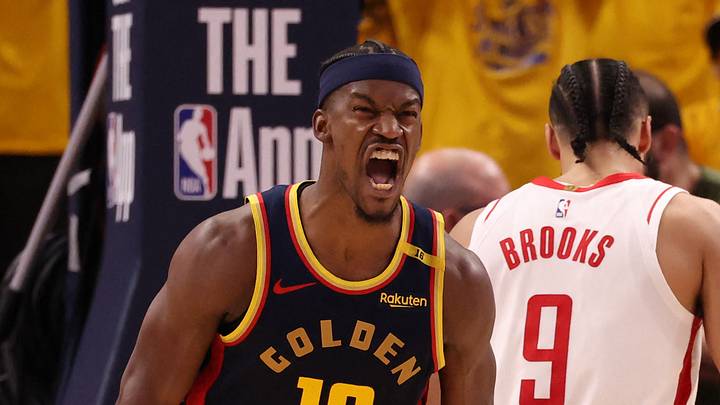 San Francisco, California, USA; Golden State Warriors forward Jimmy Butler III (10) reacts after scoring against Houston Rockets forward/guard Dillon Brooks (9) during the fourth quarter of game four of the 2025 NBA Playoffs first round at Chase Center. Mandatory Credit: Kelley L Cox-Imagn Images