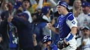 Los Angeles Dodgers catcher Will Smith (16) reacts after tagging out Toronto Blue Jays left fielder Davis Schneider (36) during the tenth inning in game three of the 2025 MLB World Series at Dodger Stadium on Monday.