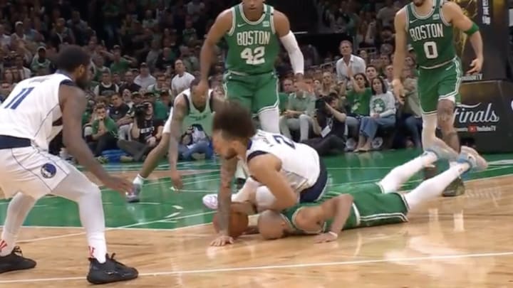 Derrick White's face meets the floor during Celtics - Mavericks Game 5. Derrick White's face meets the floor during Celtics - Mavericks Game 5.