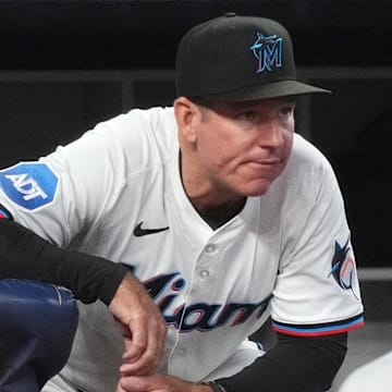 May 21, 2025; Miami, Florida, USA;  Miami Marlins manager Clayton McCullough (86) looks on from the dugout during the fourth inning against the Chicago Cubs at loanDepot Park. Mandatory Credit: Jim Rassol-Imagn Images