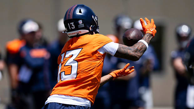 Denver Broncos rookie wide receiver Pat Bryant (13) hauls in a pass during mandatory minicamp.