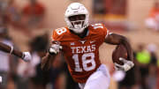 Wide receiver Isaiah Neyor runs with the ball during Texas' 2022  spring football game.